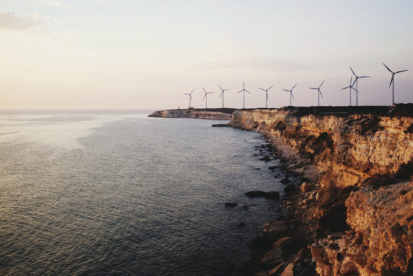 Wind turbines on a cliff by the sea